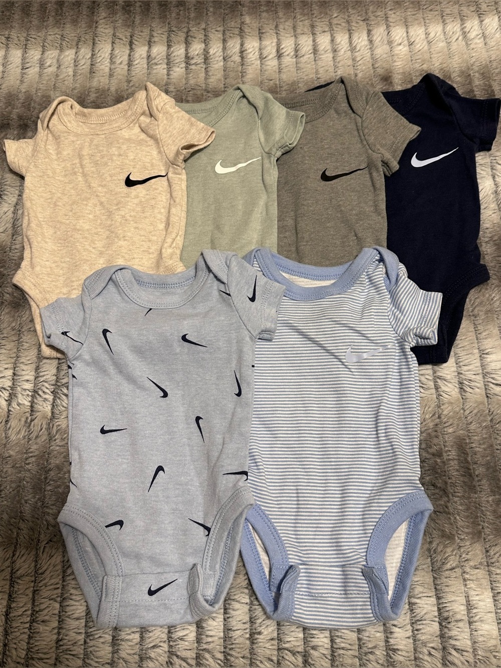 6 Nike Onesies 
Size Newborn